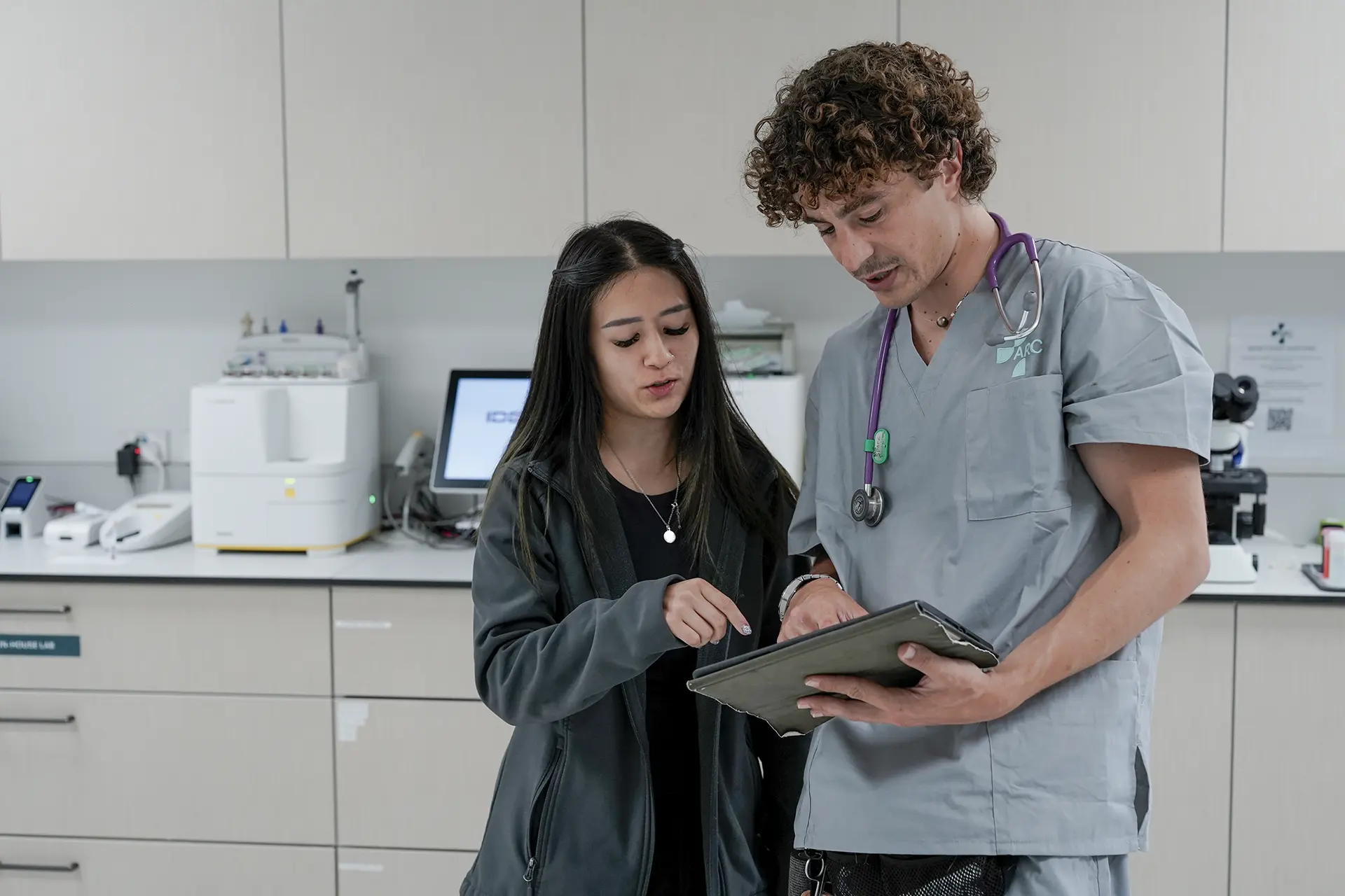 Vet tech showing client information on iPad